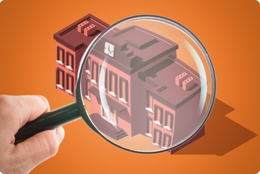 A building with a magnifying glass looming over