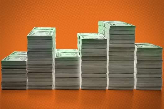 Photo illustration of piles of money.