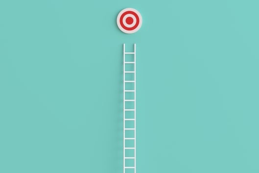 Ladder leading up to a red-and-white bull’s eye