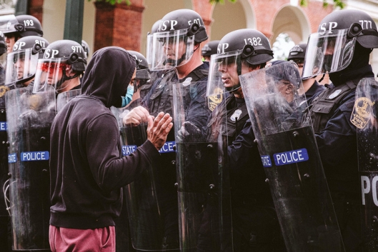 Protesters face off against police on the UVA campus.