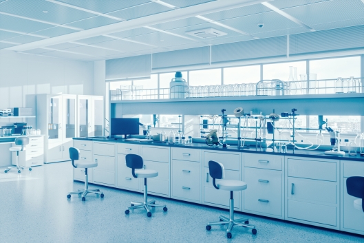 A silver-toned photo of a gleaming, modern empty science laboratory.