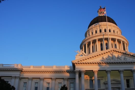The California legislature building is toward the right of the photo. There are slight shadows across the building 