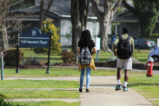 A photo of students walking on Saint Augustine's University's campus.
