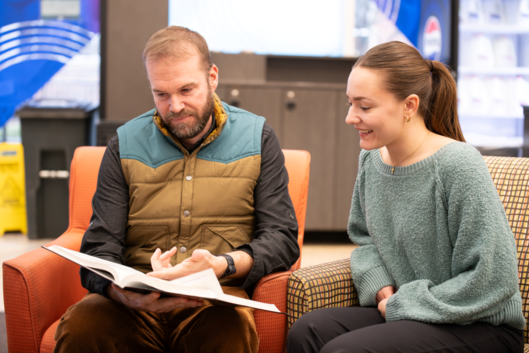 A student and professor meet to discuss the student's career goals at the University of Dayton. 