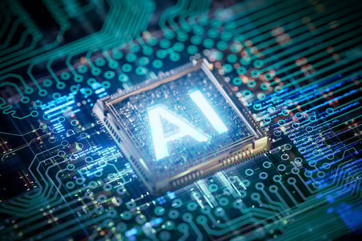 The letters "AI" are lit up on a circuit board.