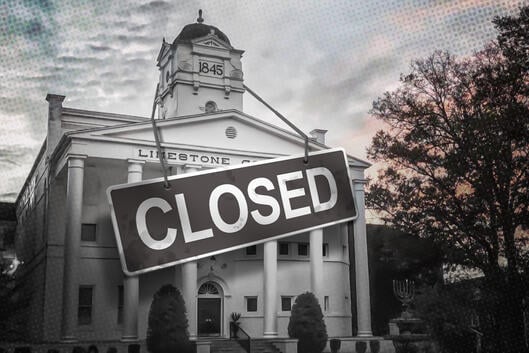 Limestone University with a closed sign on it.