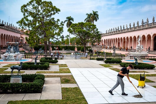 A worker cleans in the event area of the Ringling Brothers Museum in Sarasota, Fla.