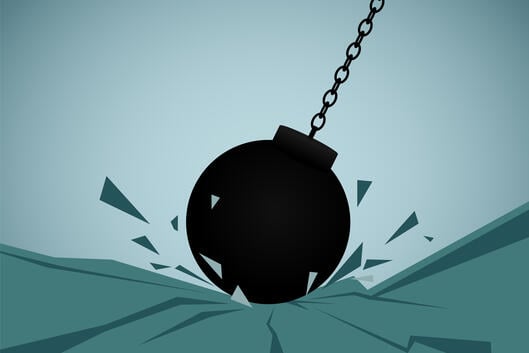 An illustration of a wrecking ball hitting ground.