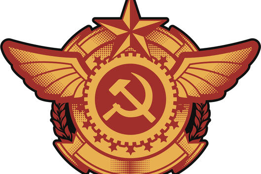 An illustration of a Soviet-style badge, with a hammer and sickle at the center.