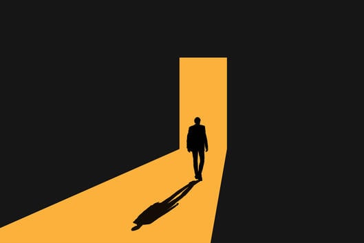 An illustration of a man, in silhouette, walking away through a door; yellow light illuminates the doorway and the path to it, while everything surrounding is black.