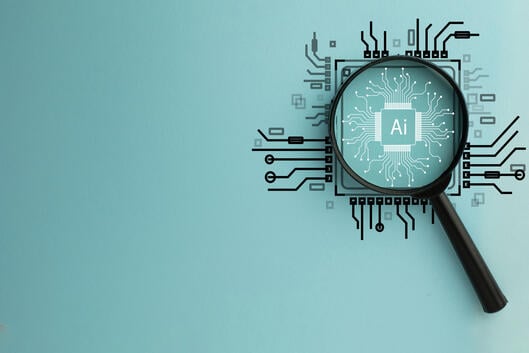 A magnifying glass lies atop a drawing of a circuit board with the letters "AI" in the center.