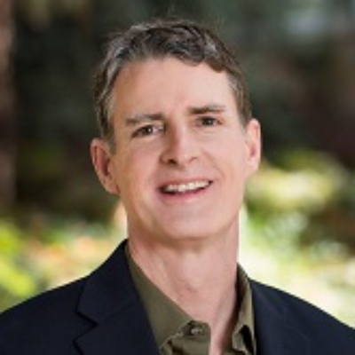 Robert Ream smiles for a headshot.