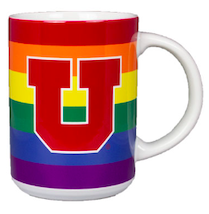 A rainbow mug with a large red U in the middle.