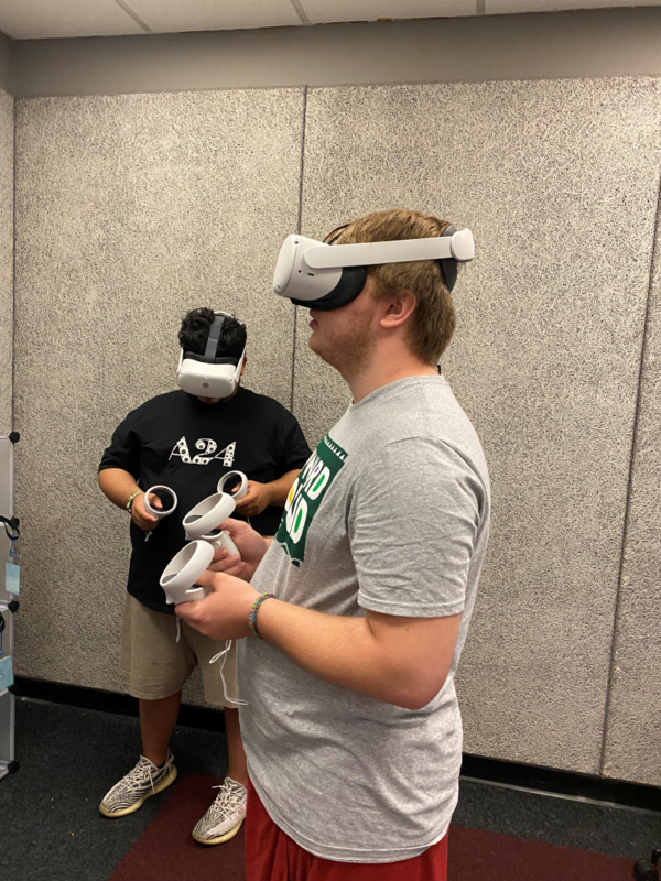 Two students wear VR headsets within IU’s Speaker’s Lab