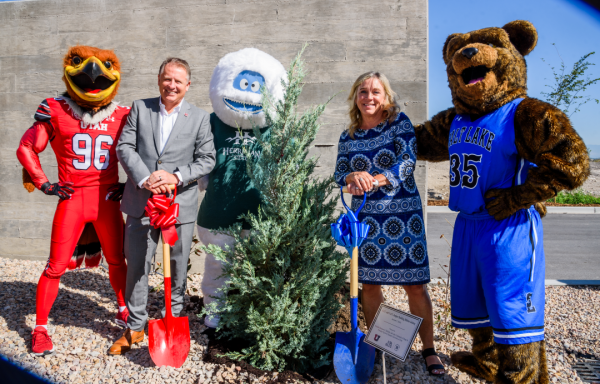 University of Utah and Salt Lake Community College presidents and mascots pose for a photo with a newly planted tree. In addition to U of U's mascot, Swoop, and SLCC's mascot, Brutus, the Herriman campus will have the Herriman Yeti. 
