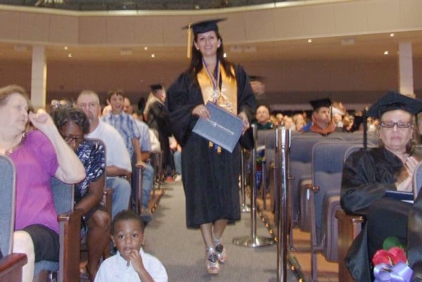 Tippetts walks at her associate degree graduation ceremony