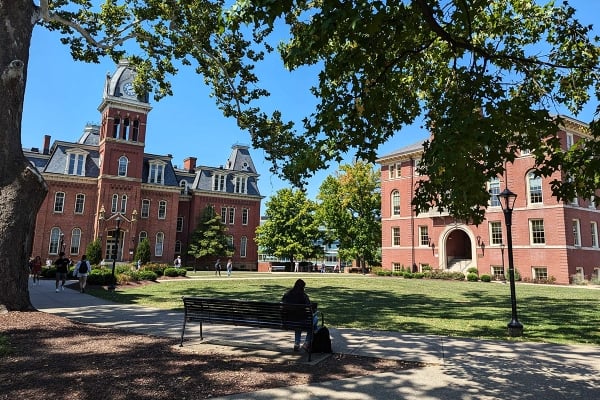 A photograph of West Virginia University’s central quad, with Woodburn Hall on the left.