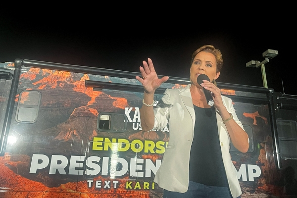 Kari Lake speaks to a group of college students at a rally