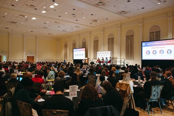 Large ballroom full of people.