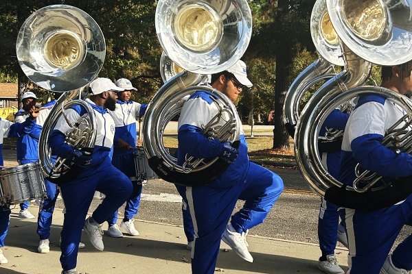 Students play the tuba in a parade