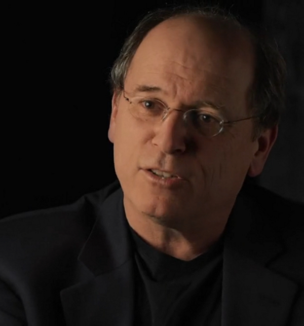 A white man with glasses