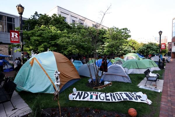 Encampment and End Genocide sign on Rutgers campus
