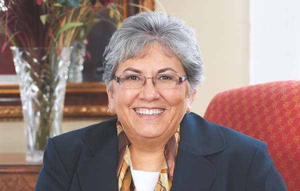 A gray-haired woman with glasses