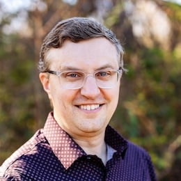Derek Bruff, a light-skinned man with brown hair and glasses.