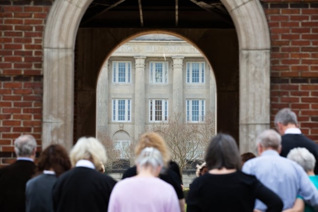 Photo of people praying on the campus of Birmingham-Southern College.