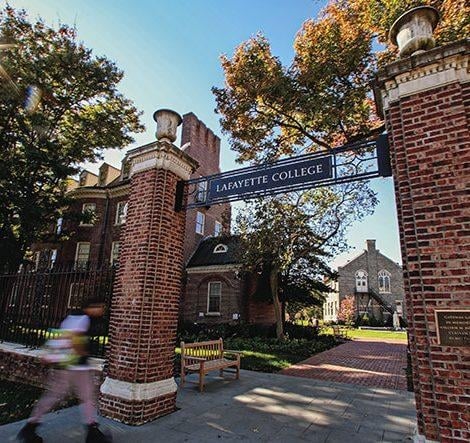 A brick gate with a Lafayette College sign