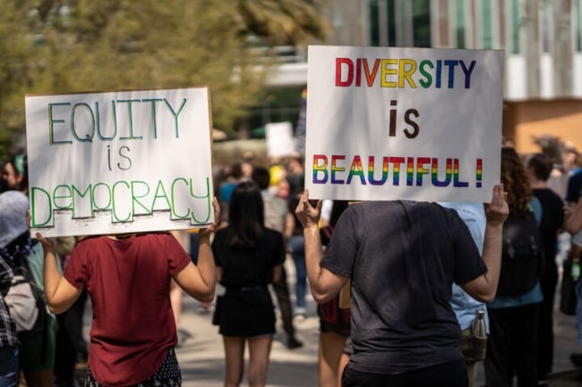 Students at the University of South Florida hold signs supporting diversity.