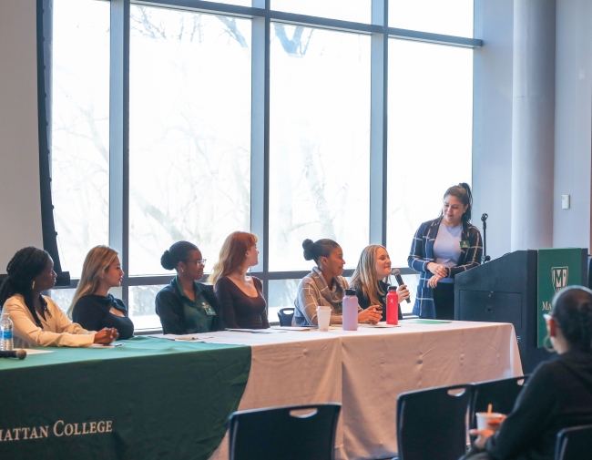 A group of women students speaking on a panel at Manhattan College.