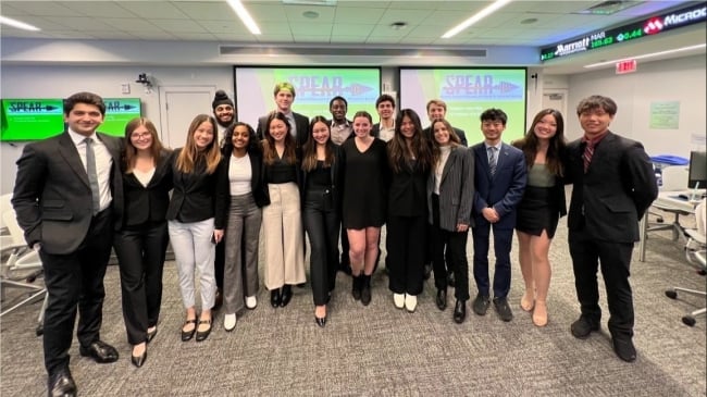 Babson College SPEAR students smile for a photo