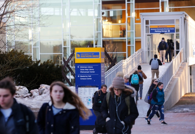 Students walking around on the campus of University of Southern Maine.