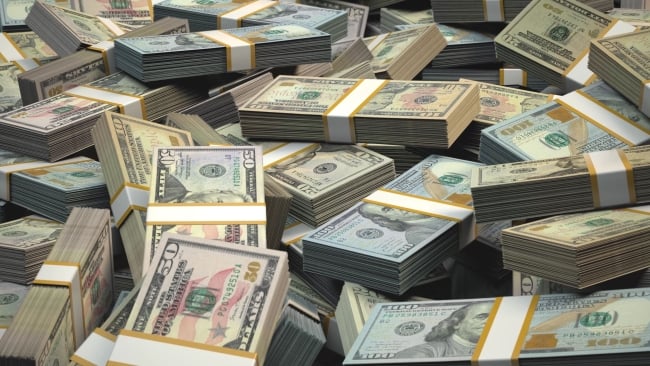 Stacks of one-hundred-dollar bills piled on top of one another