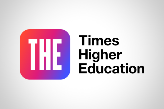 A square with rounded corners colored with a changing gradient that starts red and pink on the top left and changes to purple and blue on the bottom right. On this background are the white letters "T," "H" and "E." To the right of the rounded square, black text reads "Times Higher Education."