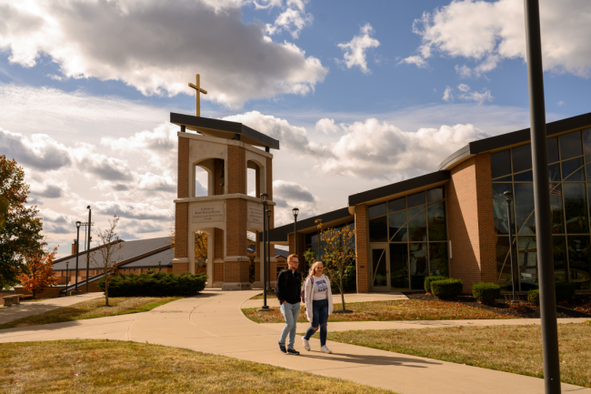 Two students walk on Thomas More University's campus.