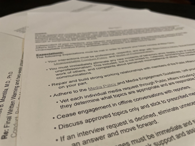 Pages of a letter including bullet points ordering a faculty member to among other things, to “Cease engagement in offline conversations with reporters.”