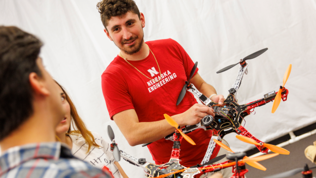 A University of Nebraska-Lincoln student holds a drone.