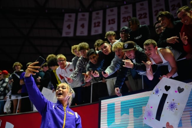 LSU gymnast Olivia Dunne taking a selfie with fans