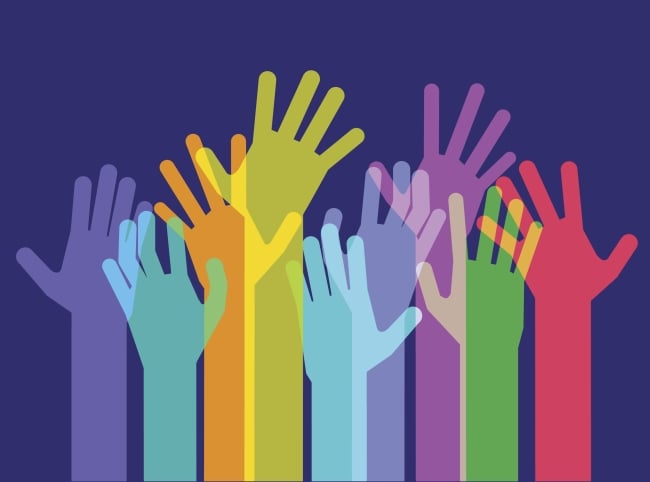 Illustration: Group of hands of all different colors outstretched and raised in the air