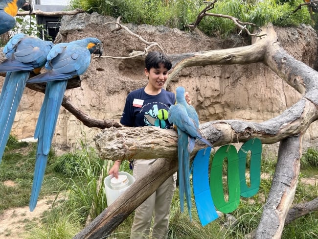 A Unity student pictured with exotic birds