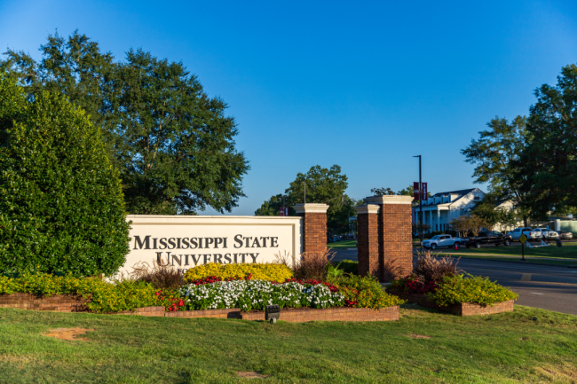 A sign outside of Mississippi State University's campus bears the university name.