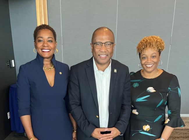 Harry Williams, CEO of TMCF, stands with Patricia Sims, president of Drake State Community & Technical College, and Kemba Chambers, president of Trenholm State Community College. All three Black leaders are smiling.