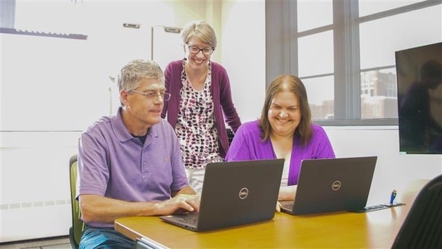 Faculty members receive support in the accessibility lab at the University of North Dakota