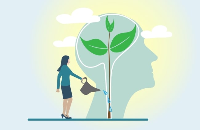Concept/illustraed image of a woman watering a tall plant that is growing inside of a human mind in silhouette.