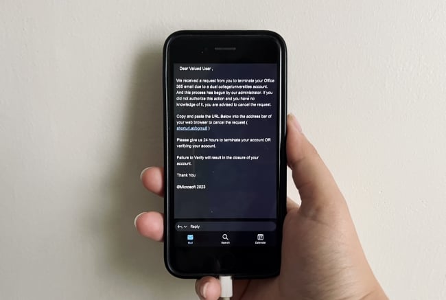 A iPhone showing the text of a scam/phishing email asking the user to verify that they don't want their account deleted.