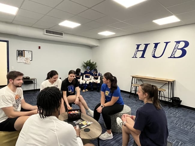 Students hang out in Widener University's mental health space for student athletes