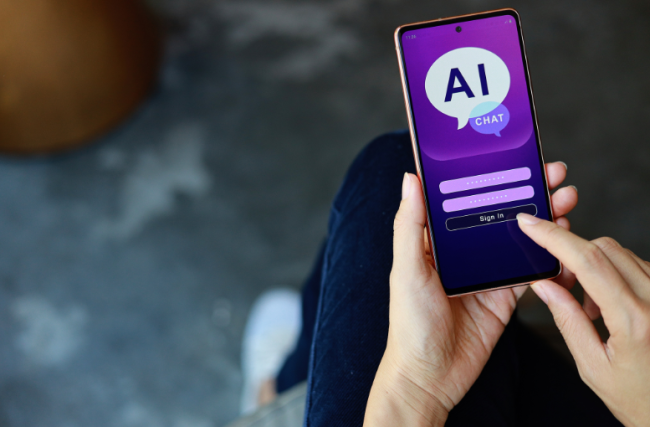 A close-up of a person's hands holding a smartphone displaying the purple log-in page for an AI chat bot.