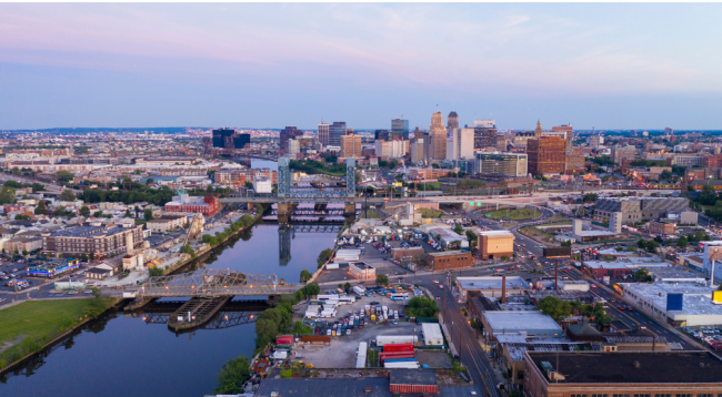 A view of Newark, N.J., featuring buildings near the river.